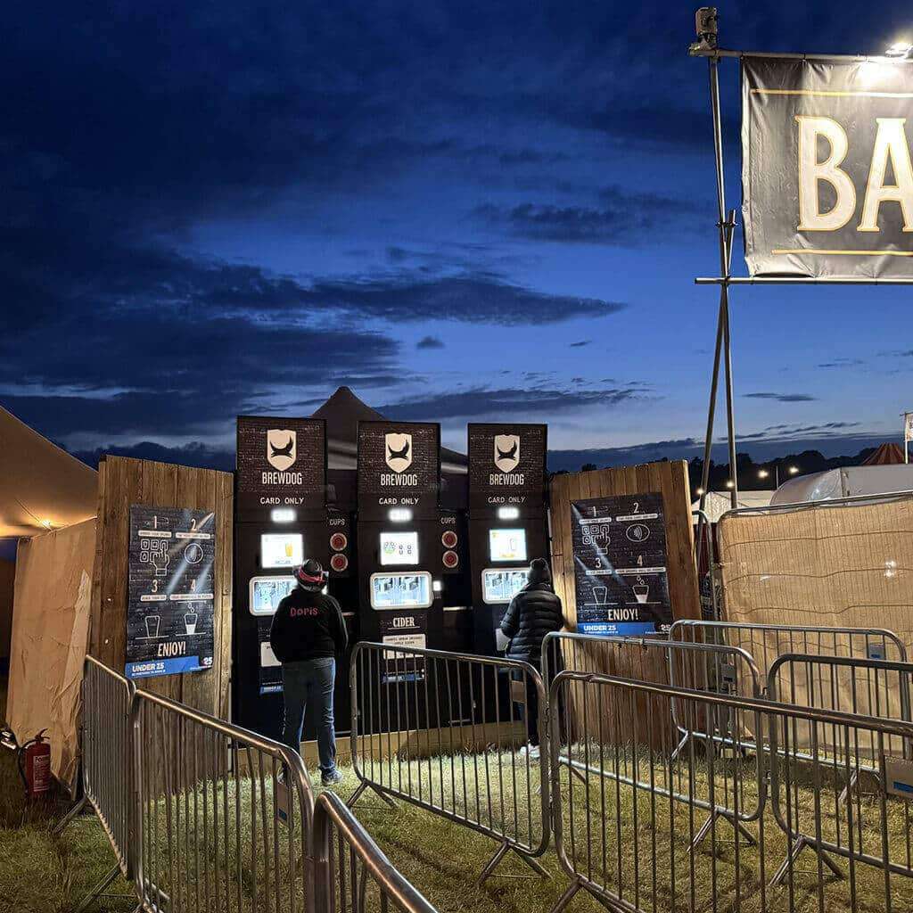 Three EBar units are still serving perfect pints as night falls at an outdoor event