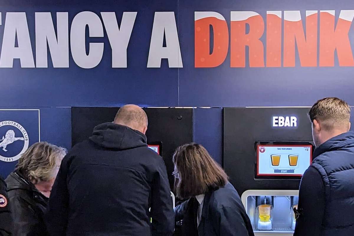 Fans making use of a club-branded 2-unit Beerwall at The Den, Millwall FC