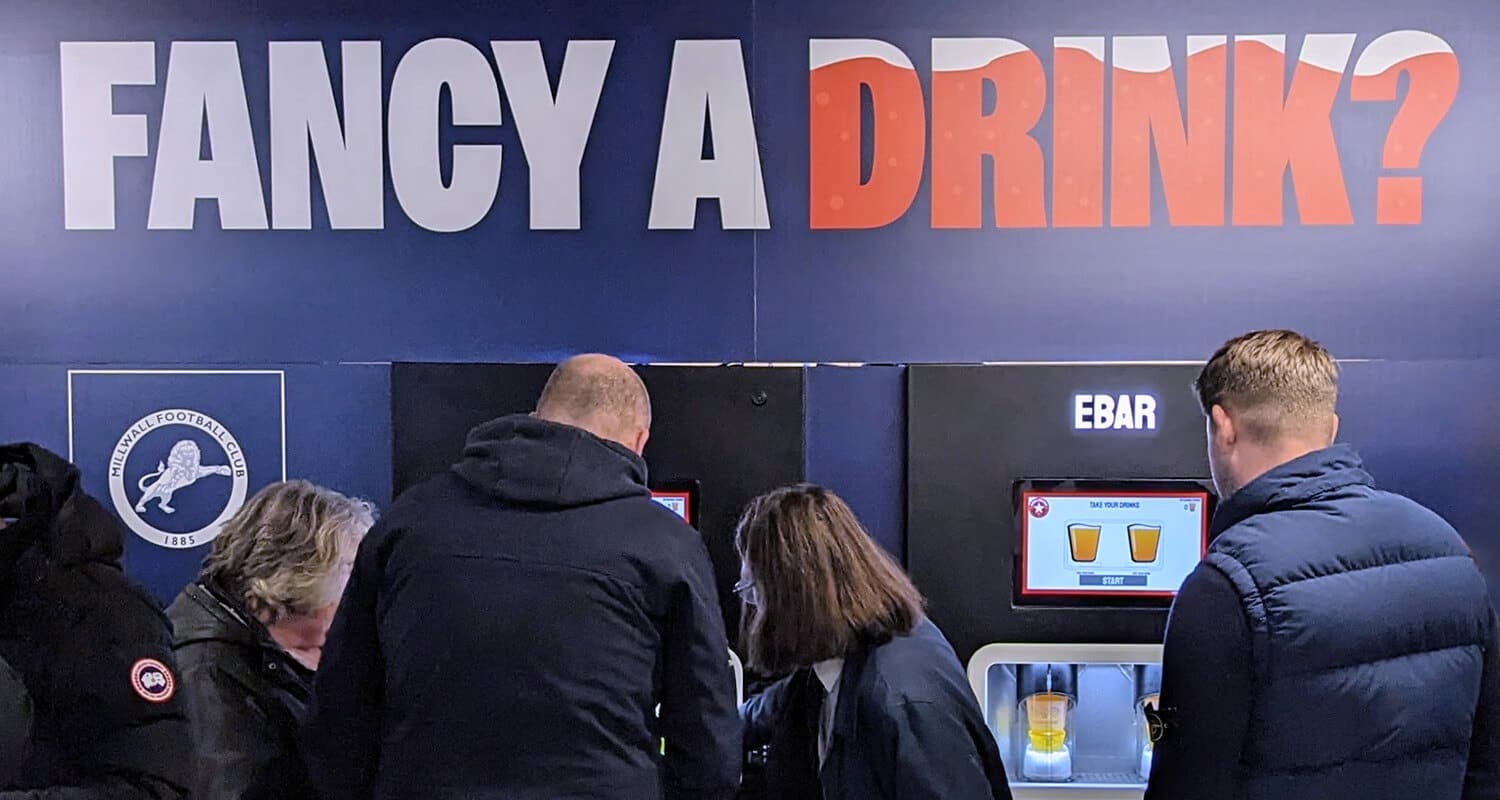 Fans making use of a club-branded 2-unit Beerwall at The Den, Millwall FC